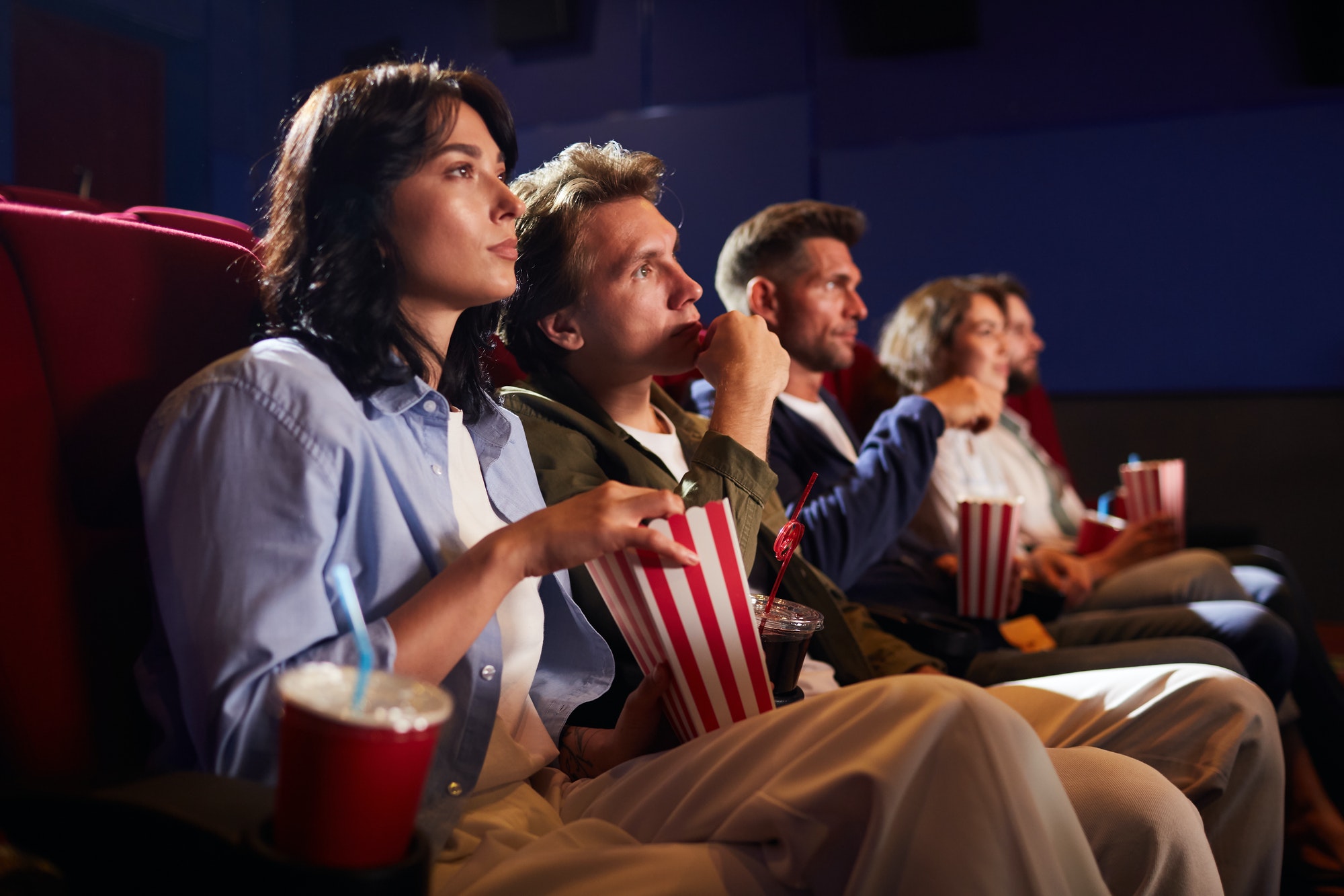 Young People Watching Movie in Cinema